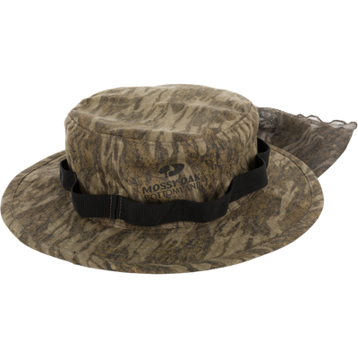 DUK Boonie Hat with Facemask featuring a Mossy Oak Bottomland logo, wide brim, adjustable chin strap, and mesh back flap for enhanced ventilation.