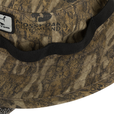 DUK Boonie Hat with Facemask featuring camo pattern, Mossy Oak Bottomland logo, stitched chin-strap, 2 brim, and adjustable drawstring for hunters and outdoor enthusiasts.