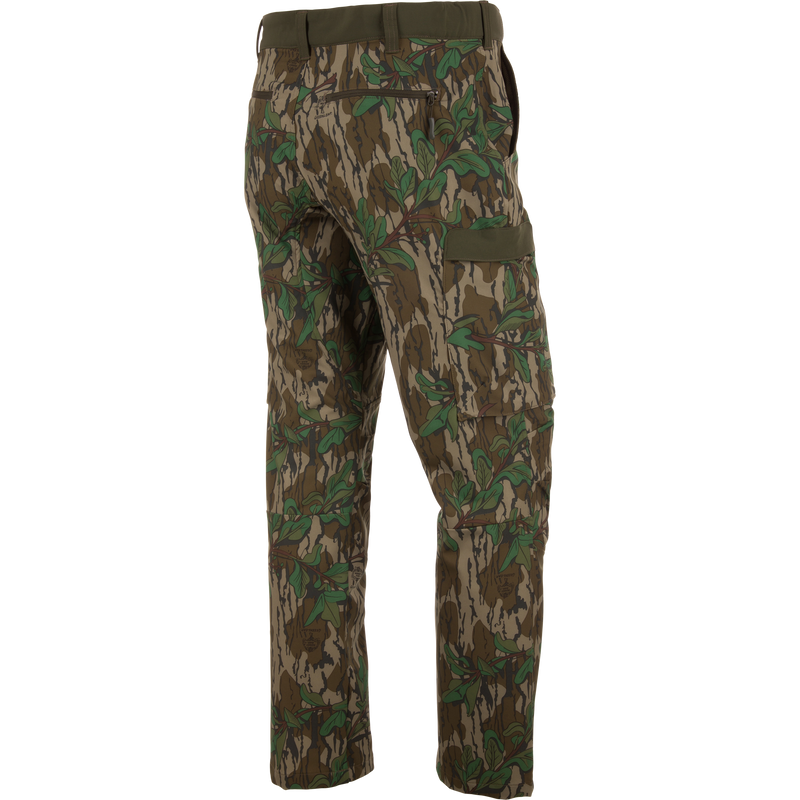 Ol' Tom Tech Stretch Turkey Pants with camouflage design, featuring cargo pockets and articulated knees, ideal for hunting flexibility and comfort.