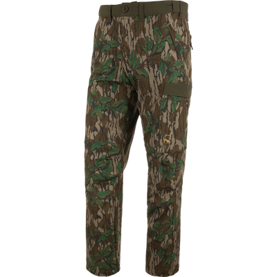 Ol' Tom Tech Stretch Turkey Pants featuring camouflage design, large cargo pockets, and articulated knees, ideal for hunting comfort and flexibility.