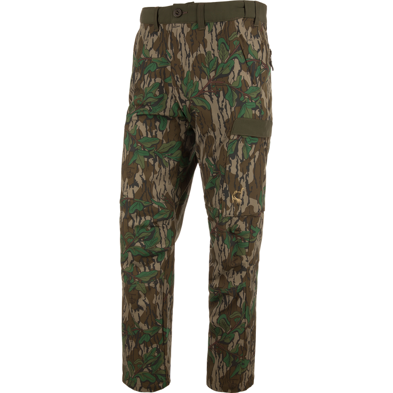 Ol' Tom Tech Stretch Turkey Pants featuring camouflage design, large cargo pockets, and articulated knees, ideal for hunting comfort and flexibility.