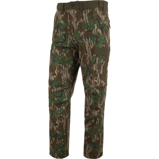 Ol' Tom Tech Stretch Turkey Pants featuring camouflage design, large cargo pockets, and articulated knees, ideal for hunting comfort and flexibility.