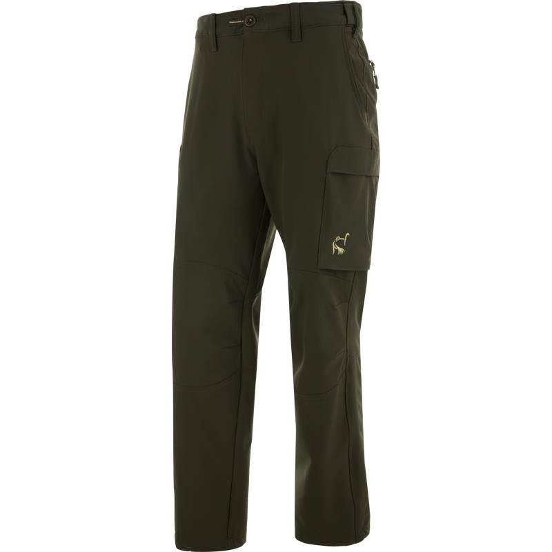 Ol' Tom Tech Stretch Turkey Pants with zip-up side pockets, thigh flap pocket, and articulated knees for comfort and flexibility in hunting activities.