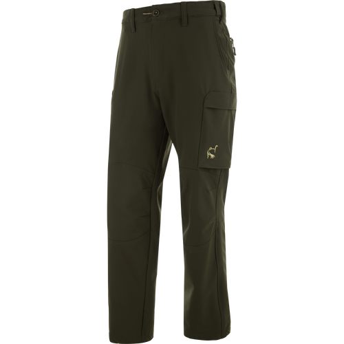 Ol' Tom Tech Stretch Turkey Pants with zip-up side pockets, thigh flap pocket, and articulated knees for comfort and flexibility in hunting activities.
