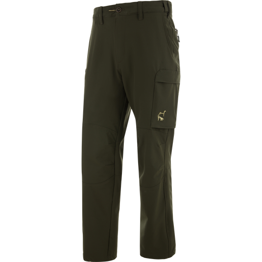 Ol' Tom Tech Stretch Turkey Pants with zip-up side pockets, thigh flap pocket, and articulated knees for comfort and flexibility in hunting activities.
