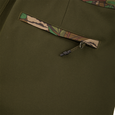 Turkey Bib with Spider Web Technology featuring close-up of durable zipper and fabric, showcasing breathable, water-resistant polyester ideal for hunting adventure.