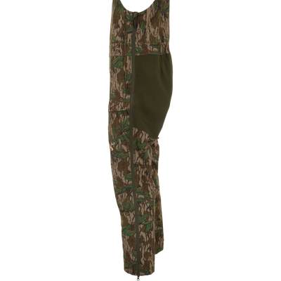 Turkey Bib with Spider Web Technology, featuring camouflage design, zippered sides, and cargo pockets, offers durability and mobility for hunting enthusiasts.