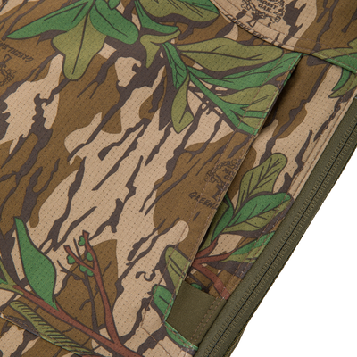 Close-up of the Turkey Bib with Spider Web Technology, showcasing its camouflage pattern and durable polyester fabric designed for hunting comfort and mobility.