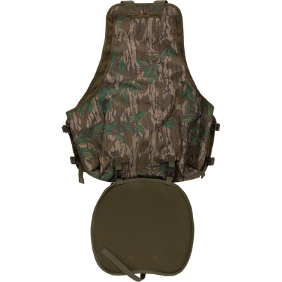Youth Time and Motion Turkey Vest featuring camouflage design, quick-draw slate call pouch, removable padded seat cushion, and neoprene shoulder straps for hunting.