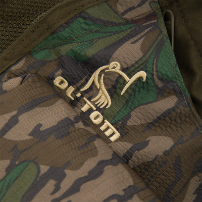 Youth Time and Motion Turkey Vest close-up showing camouflage fabric, durable stitching, and accessible pouches for hunting gear essentials.