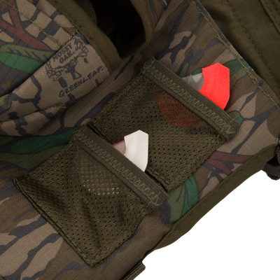 Youth Time and Motion Turkey Vest close-up, highlighting durable 300 denier rip-stop fabric with visible pocket and red tag detail for hunting utility.