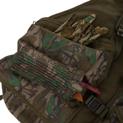 Youth Time and Motion Turkey Vest with camouflage pattern, featuring gloves, a bag, and quick-draw pouches, ideal for hunting.
