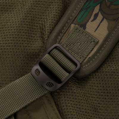 Close-up of Youth Time and Motion Turkey Vest, highlighting durable strap and buckle, designed for easy access to hunting gear and comfort during turkey hunting.