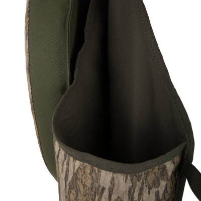 Close-up of Turkey Strap Vest, highlighting rugged nylon panel, camo-print fabric, and open pocket, designed for efficient gear placement during turkey hunting.