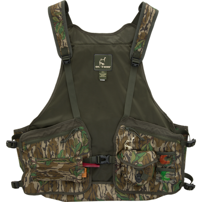 Turkey Strap Vest with camo pattern, featuring adjustable straps, multiple utility pockets, and a removable seat cushion for efficient turkey hunting gear management.