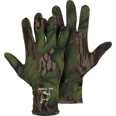 Drake Waterfowl Performance Turkey Gloves featuring camouflage pattern, silicone grip dots, and a logo, designed for lightweight comfort and dexterity in hunting.