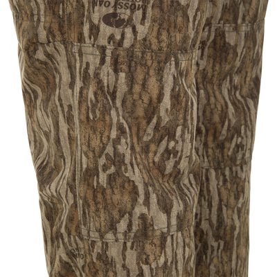 Close-up of Ol' Tom Early Bird SWT Pant, showcasing Mossy Oak camouflage, stitching, and pocket details, designed for lightweight comfort and insect protection during warm-weather hunts.