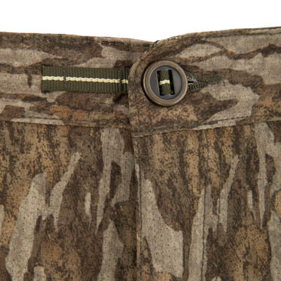 Close-up of the Ol’ Tom Early Bird SWT Pant waistband, showing a camo pattern, button, and internal adjustment tab for customizable fit during hunting.