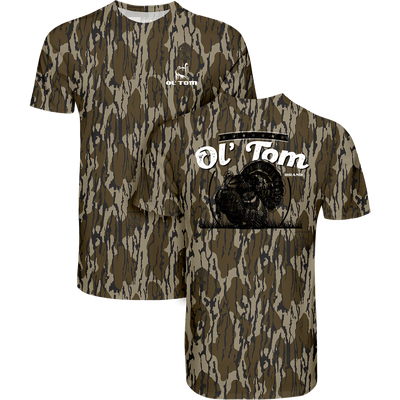 Ol Tom Full Strut T-Shirt with woodland camo pattern, featuring a turkey logo on chest and back. Lightweight, comfy 60% cotton, 40% polyester blend.