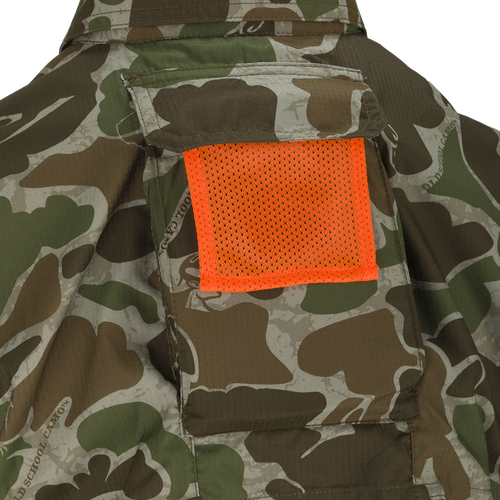 A close-up of the Ol' Tom Youth Mesh Back Flyweight Shirt 2.0, a lightweight hunting shirt with a camouflage pattern and mesh back panel.
