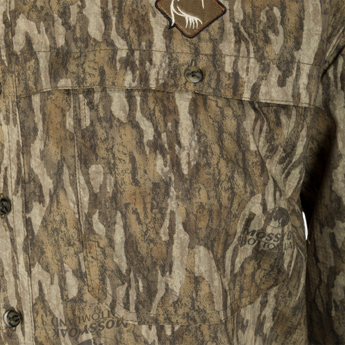A close-up of the Ol’ Tom Men's Mesh Back Flyweight Turkey Shirt with a button and fabric detail.