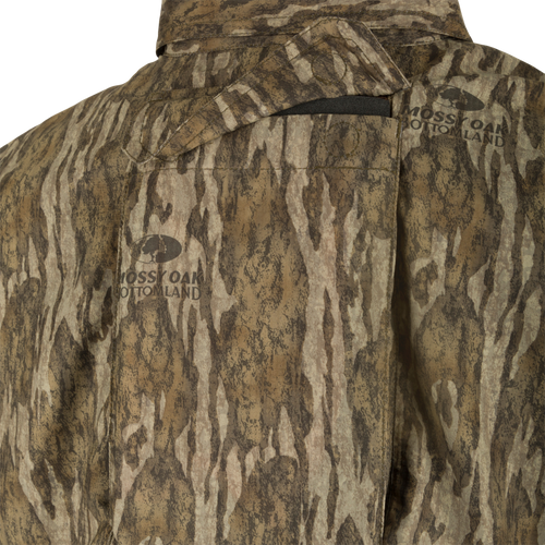 A close-up of the Ol' Tom Men's Mesh Back Flyweight Turkey Shirt, featuring a camouflage fabric and a mesh back panel for breathability and comfort.