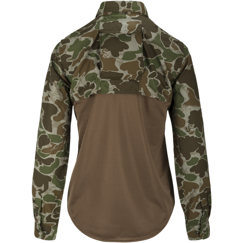 A technical version of a classic button-down hunting shirt for women. Features a mesh back panel, removable spine pad, and UPF 50+ sun protection. Lightweight and breathable. Perfect for hunting and outdoor activities.