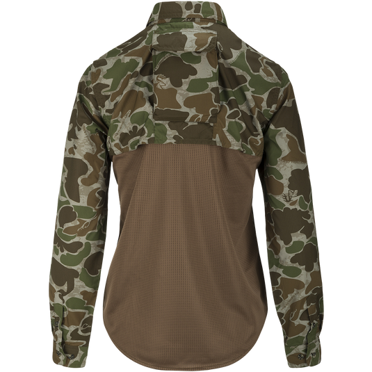 A technical version of a classic button-down hunting shirt for women. Features a mesh back panel, removable spine pad, and UPF 50+ sun protection. Lightweight and breathable. Perfect for hunting and outdoor activities.