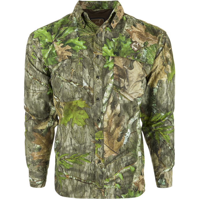 A youth mesh back flyweight shirt with a camouflage pattern, featuring a spine pad for increased comfort while hunting. Lightweight and breathable, perfect for outdoor activities.