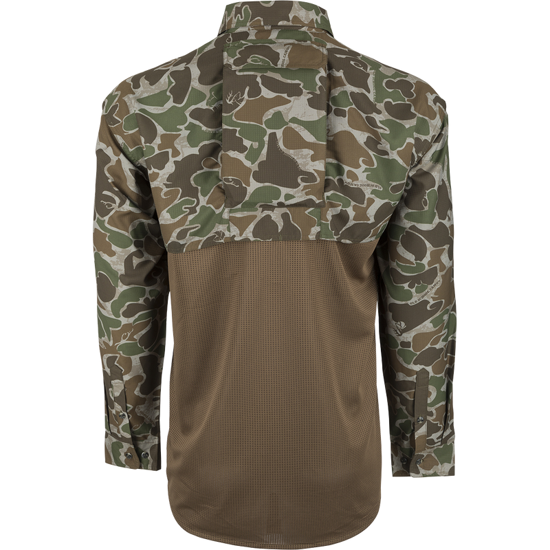 A youth mesh back flyweight shirt with a removable spine pad for increased breathability and comfort while hunting. Lightweight and quick-drying, with UPF 50+ sun protection. Features two large chest pockets with buttons and a relaxed comfort fit. From Drake Waterfowl, high-quality hunting gear and clothing for big game, waterfowl, turkey, and fishing.