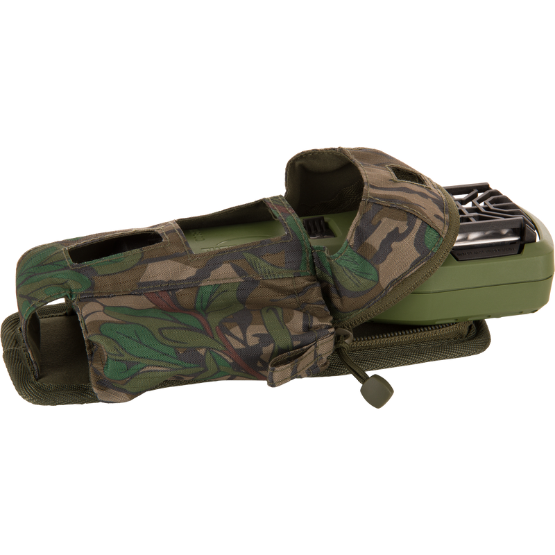 Thermacell Pouch 2.0 with Molle Attachment, featuring a camouflage fabric pouch, Velcro, and zipper, partially conceals a handheld device with a black grille-style opening.