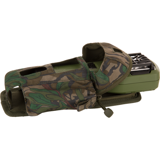 Thermacell Pouch 2.0 with Molle Attachment, featuring a camouflage fabric pouch, Velcro, and zipper, partially conceals a handheld device with a black grille-style opening.