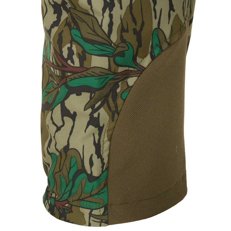 A close-up of the Women's Tech Stretch Turkey Pant, featuring a camouflage pattern and durable fabric for spring turkey hunting.