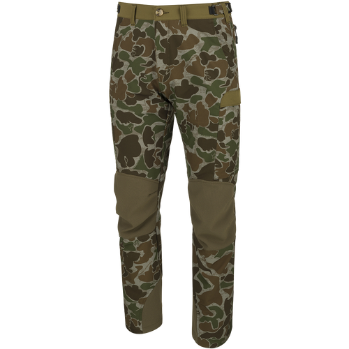 Men's Tech Stretch Turkey Hunting Pant with 4-way stretch, reinforced knees, gusseted crotch, and cargo pockets for hunting gear. Designed for comfort and durability in the woods.