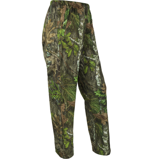 A pair of Ultralight Packable Rain Pants, perfect for spring showers during turkey season. Waterproof, windproof, and breathable, these pants are made of Performance LITE 3-Layer Stretch fabric. Easily packable in a 7" X 3" elastic closure bag. Stay dry with taped seams and a shock cord waist. Ideal for outdoor enthusiasts.