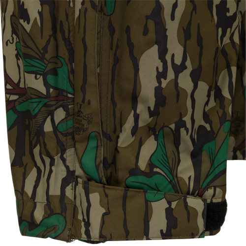 A close-up of the Ultralight Packable Rain Pant, featuring a camouflage pattern fabric. Waterproof, windproof, and breathable, perfect for spring showers during turkey season. Easily packable in a 7