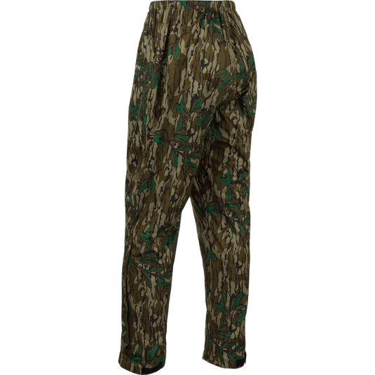 A pair of Ultralight Packable Rain Pants with a camouflage pattern, perfect for staying dry during spring showers while hunting.