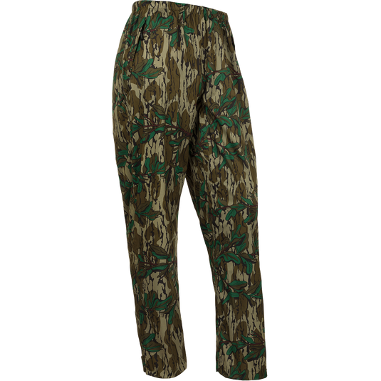 A pair of Ultralight Packable Rain Pants with a leaf pattern, perfect for spring showers during turkey season. Waterproof, windproof, and breathable, these pants are made with Performance LITE 3-Layer Stretch fabric. Easily packable in a 7" X 3" elastic closure bag. Ideal for outdoor activities like big game hunting, waterfowl hunting, turkey hunting, and fishing.