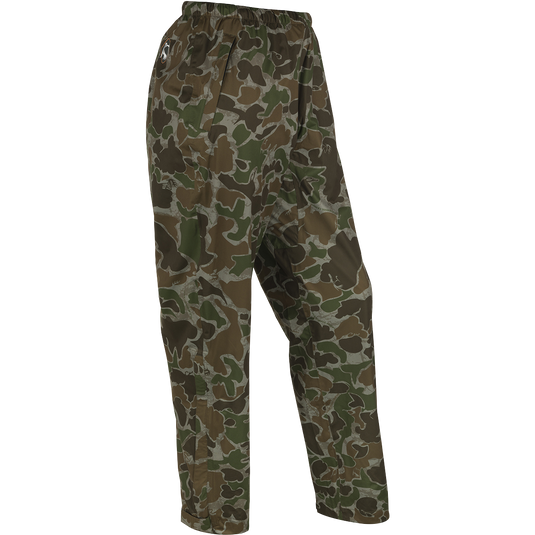 A pair of packable rain pants for outdoor enthusiasts. Waterproof, windproof, and breathable. Perfect for spring showers during turkey season. Easily packable in a 7" X 3" bag. Fits over your original outerwear. From Drake Waterfowl, your go-to store for high-quality hunting gear and clothing.