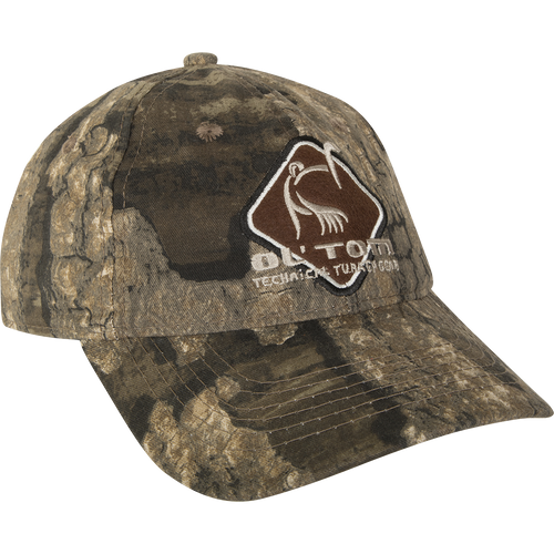 A camouflage cotton cap with a mid-profile fit and a logo on it - Camo Cotton Ol' Tom Diamond Logo Cap - Realtree.