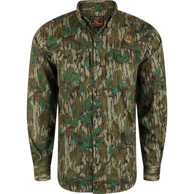 Men's Camo Wingshooter Trey Shirt L/S: Old School Green camo shirt with logo, hidden collar, chest pockets, vented back, and technical features for hunting and outdoor activities.
