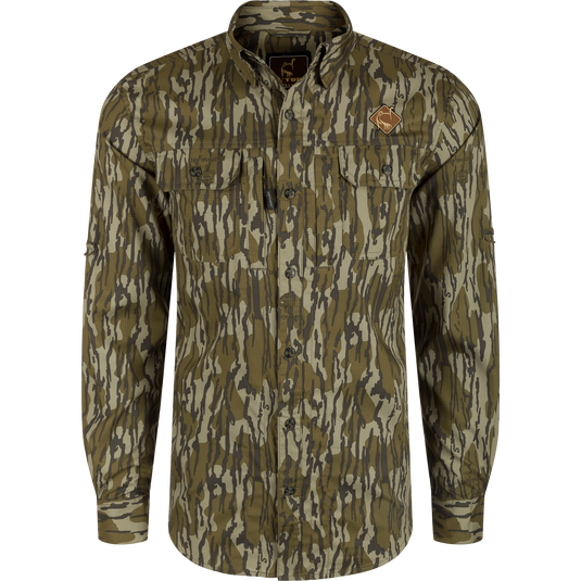 Men's Camo Wingshooter Trey Shirt L/S: Silky polyester-spandex blend, UPF30, moisture-wicking, hidden collar, vented back, chest pockets, sunglass wipe, adjustable sleeves. Drake Waterfowl's high-performance hunting apparel.