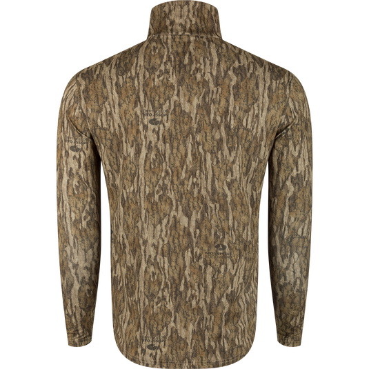 A close-up of the Ol' Tom Performance 1/4 Zip shirt with a camo pattern, perfect for hot-weather turkey hunting. Moisture-wicking, ultralight fabric with quick-drying properties and sun protection.