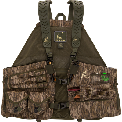 RTL - Gunslinger Vest 2.0: Camouflage hunting vest with adjustable straps, multiple pockets for gear, and quick-release buckles, designed for organized, intuitive turkey hunting.