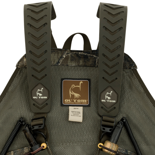A close-up of the Time & Motion™ Gunslinger Turkey Vest, featuring a well-organized design with multiple pockets and straps for easy access to calls and gear.