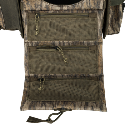 Turkey Chest Pack with multiple zippered pockets, detachable bino harness, and stowable rain fly, designed for lightweight hunting trips and gear organization.
