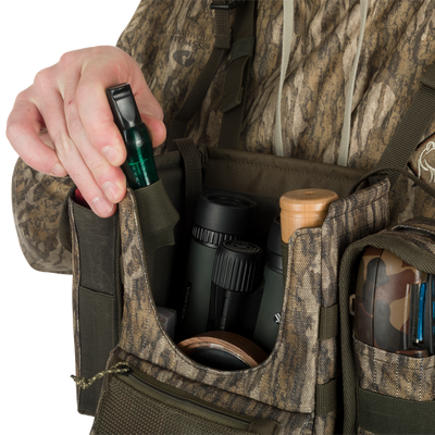 Turkey Chest Pack with detachable bino harness, multiple pockets, and stowable rain fly, perfect for hunting trips.