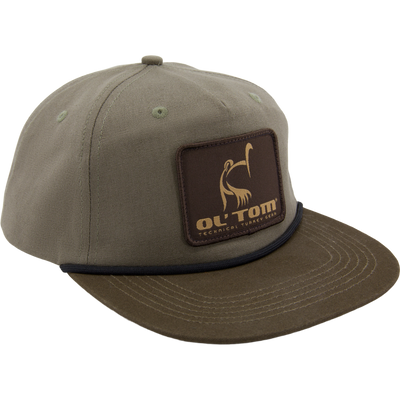 Olive-green Lost Hat X Ol Tom Goat Rope Hybrid Cap with embroidered turkey patch, canvas fabric, and paracord detailing, designed for serious turkey hunting.