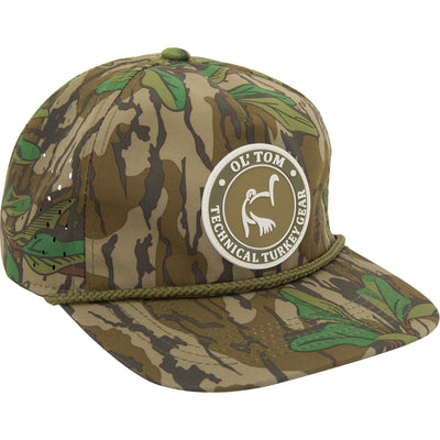 Ol' Tom Perforated Cap with camo pattern, braided brim rope, and Ol’ Tom Technical Turkey Gear patch; features laser-cut ventilation and adjustable snap-back closure.