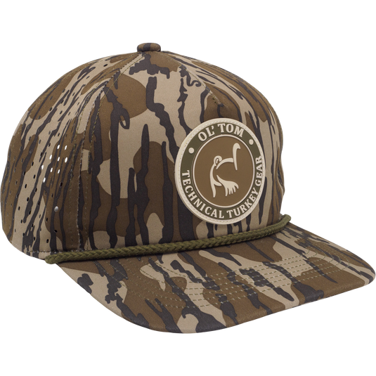 Ol' Tom Perforated Cap featuring a camo pattern with stitched rope detail and OL’ TOM • TECHNICAL TURKEY GEAR patch, ideal for hunting enthusiasts.
